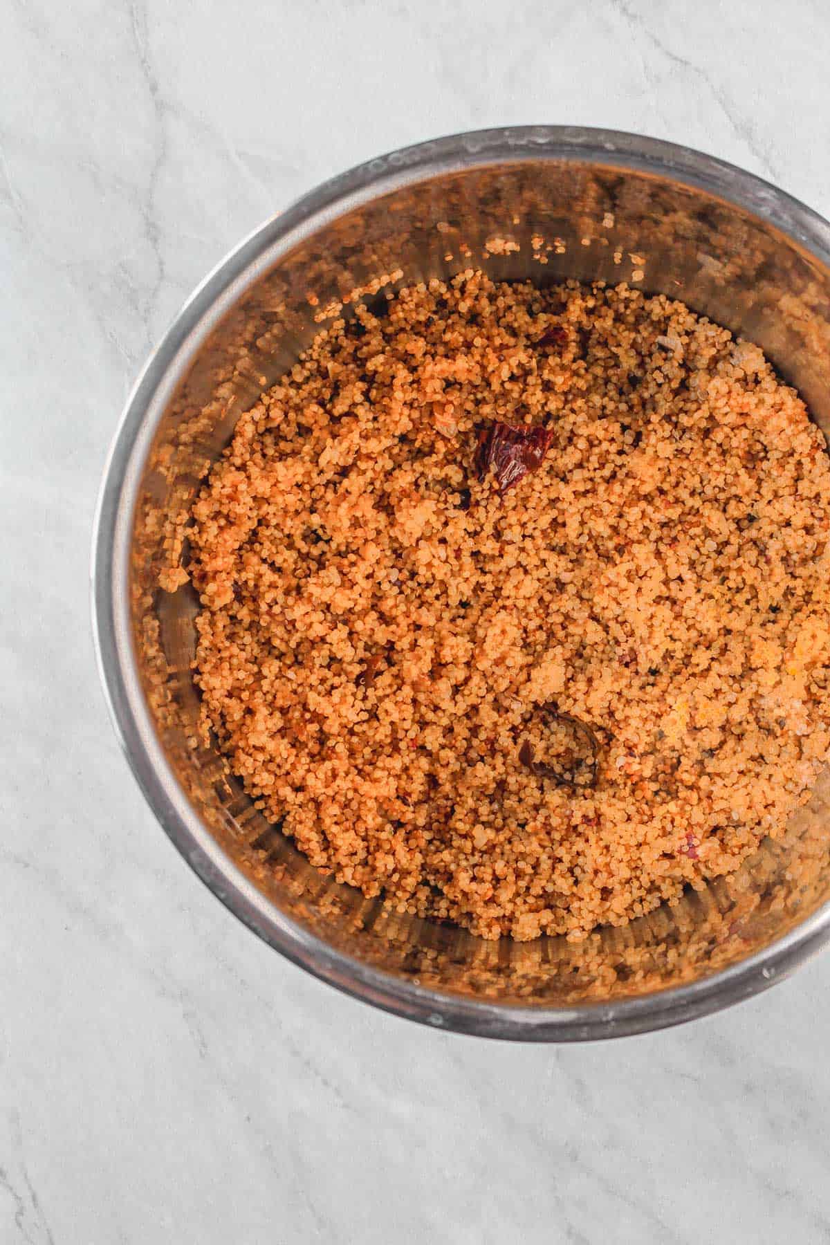 Cooked garlic chipotle quinoa inside inner instapot pot.