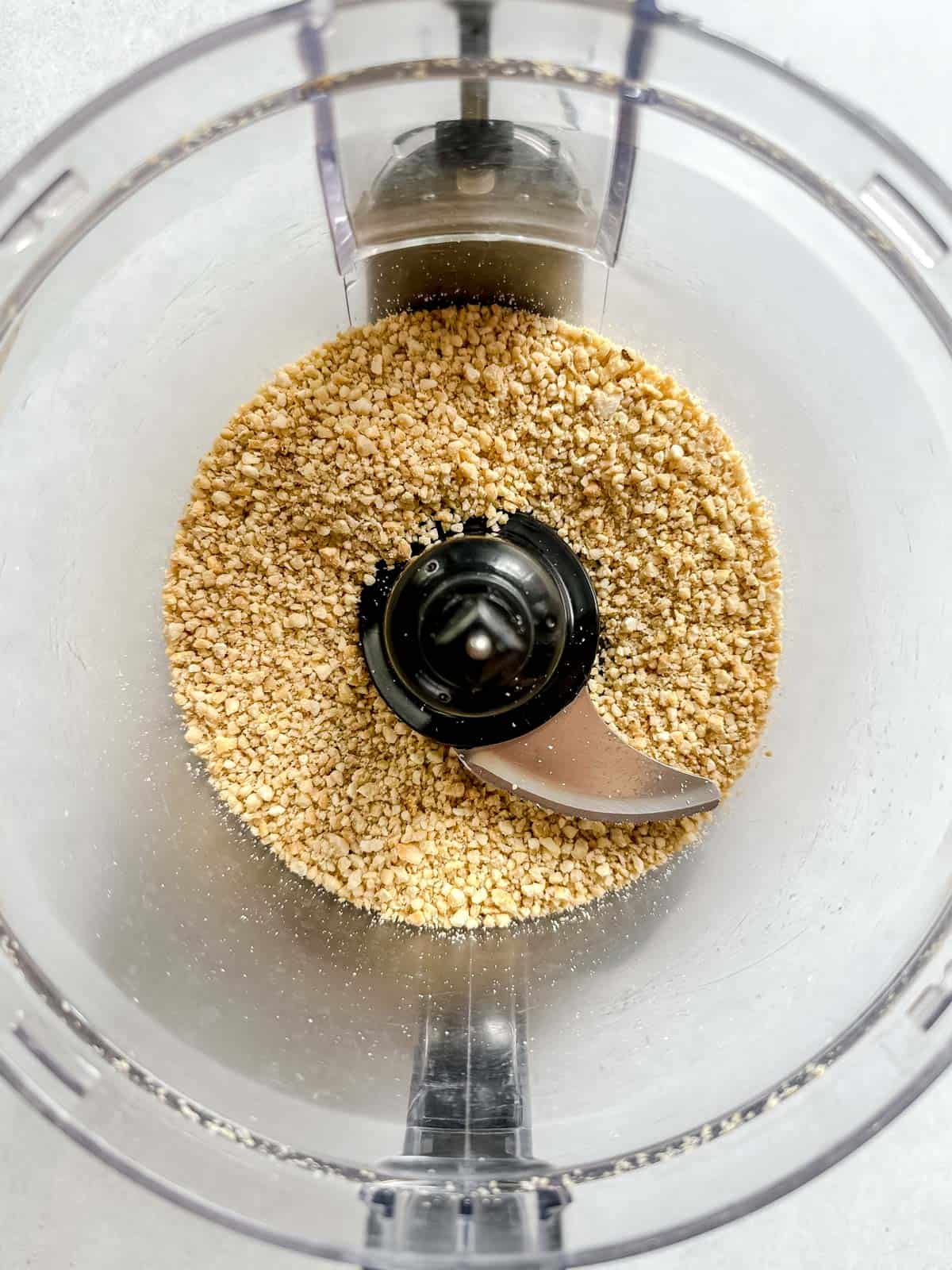 Pulsed or crumbled dry cashews in food processor