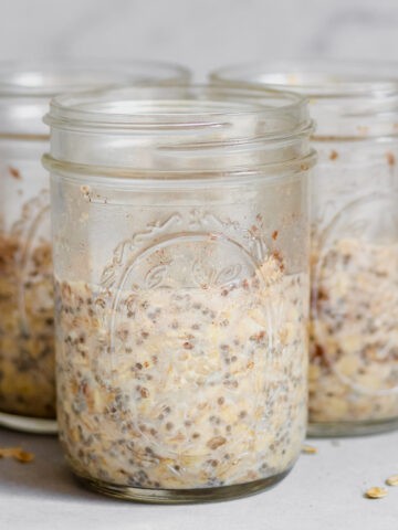 Cardamom overnight oats in 3 wide mouth mason jars