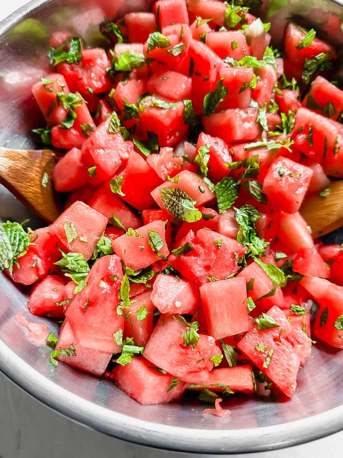 Watermelon and mint in mixing bowl