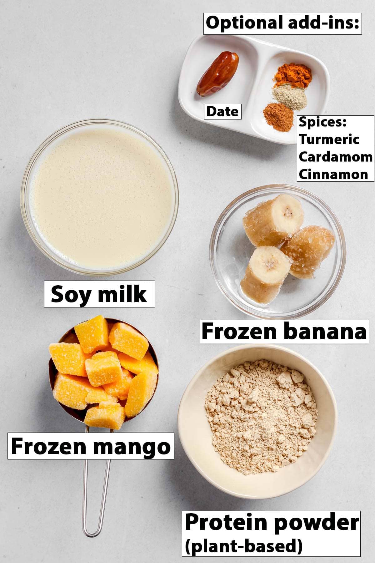 Individual smoothie ingredients in bowls on white background.
