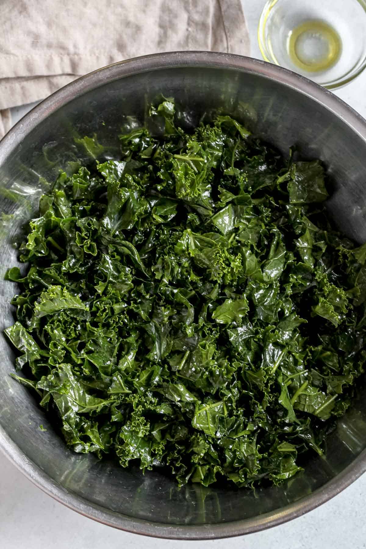 Massaged kale in stainless steel bowl