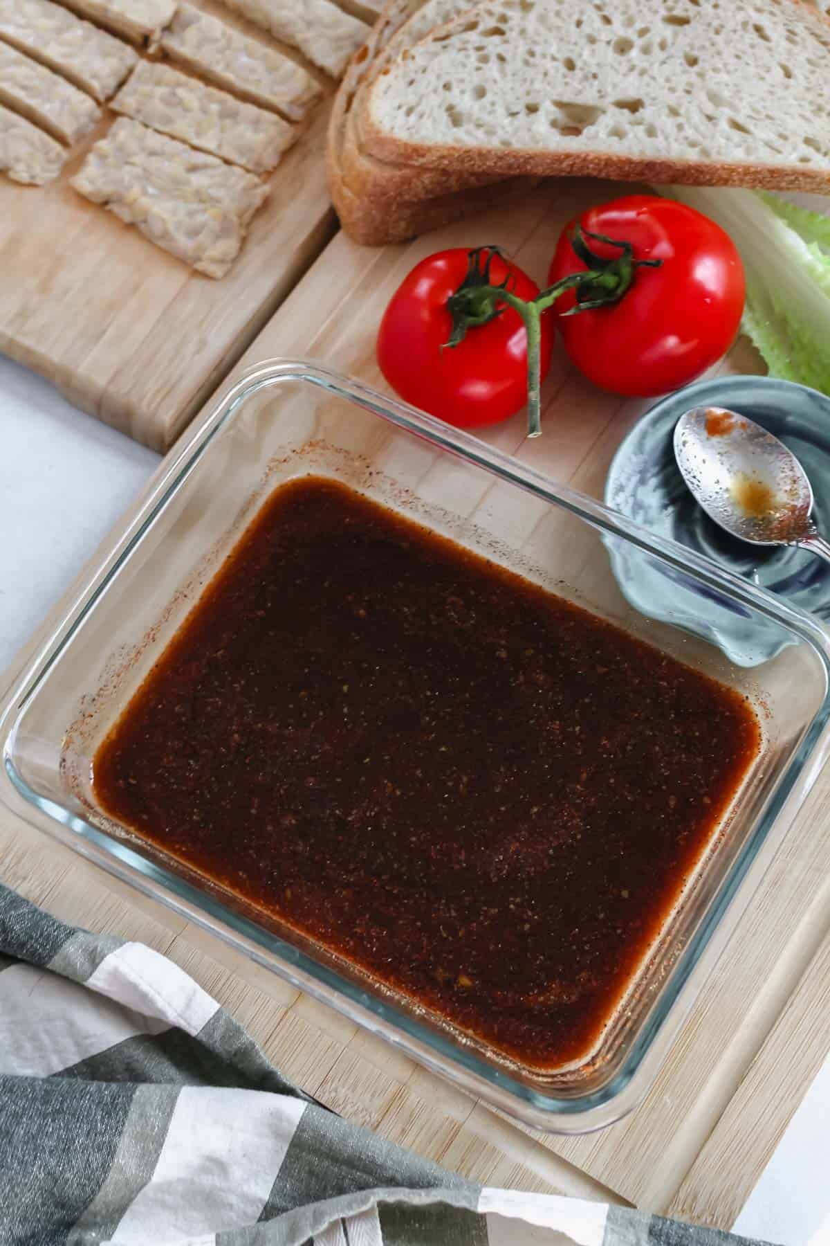 Marinade for tempeh bacon mixed together in glass container