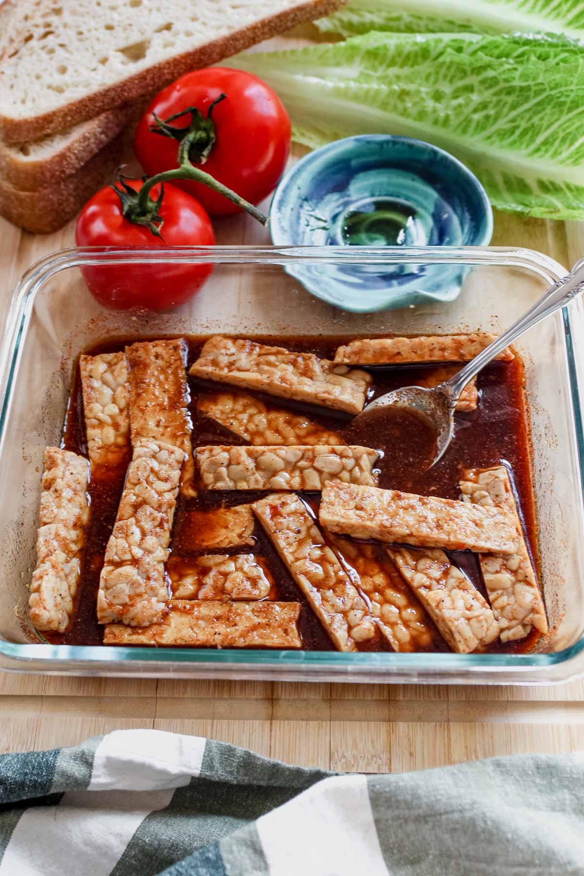 Marinating tempeh bacon in glass container